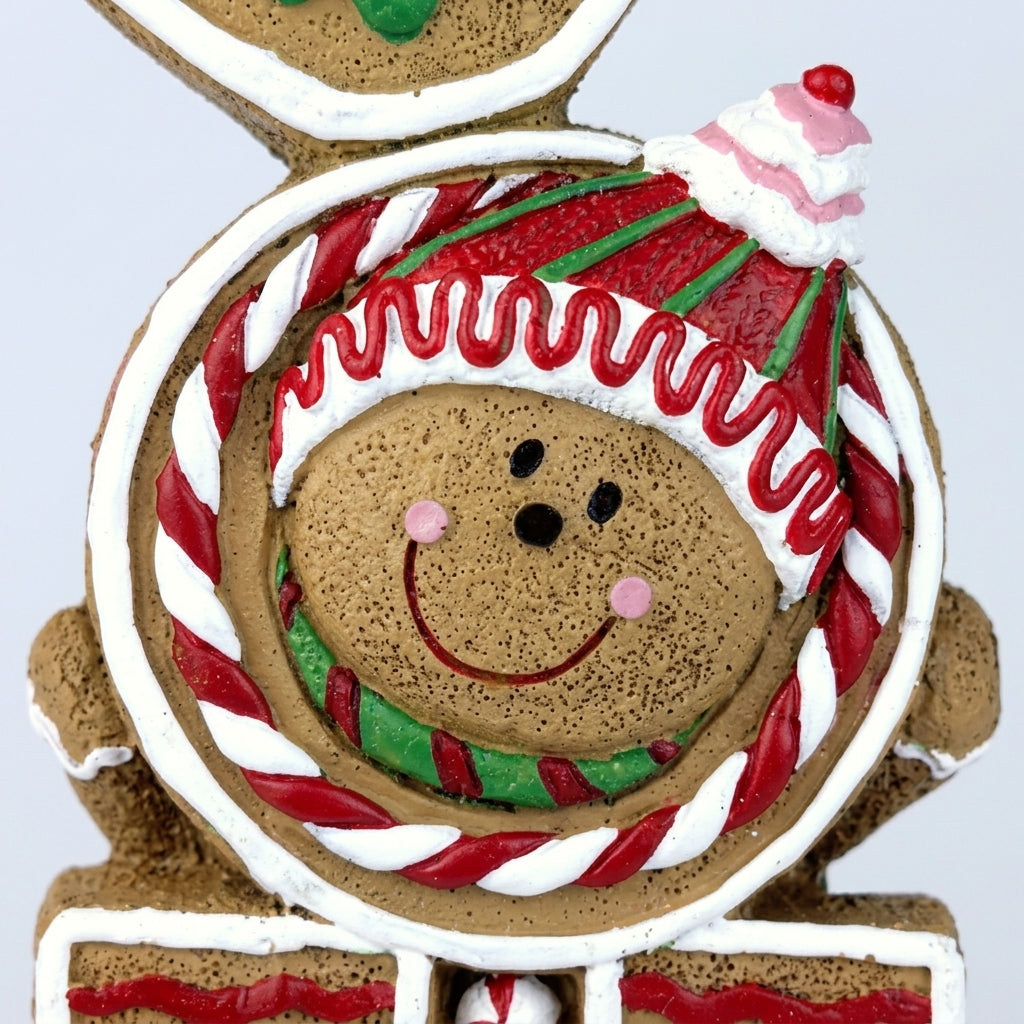 JOY Sign - Close-up details of Christmas gingerbread JOY standing sign cookie face and icing